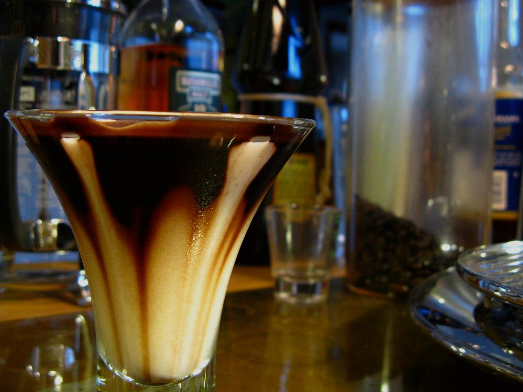 A glass of Irish whiskey in a dark bar